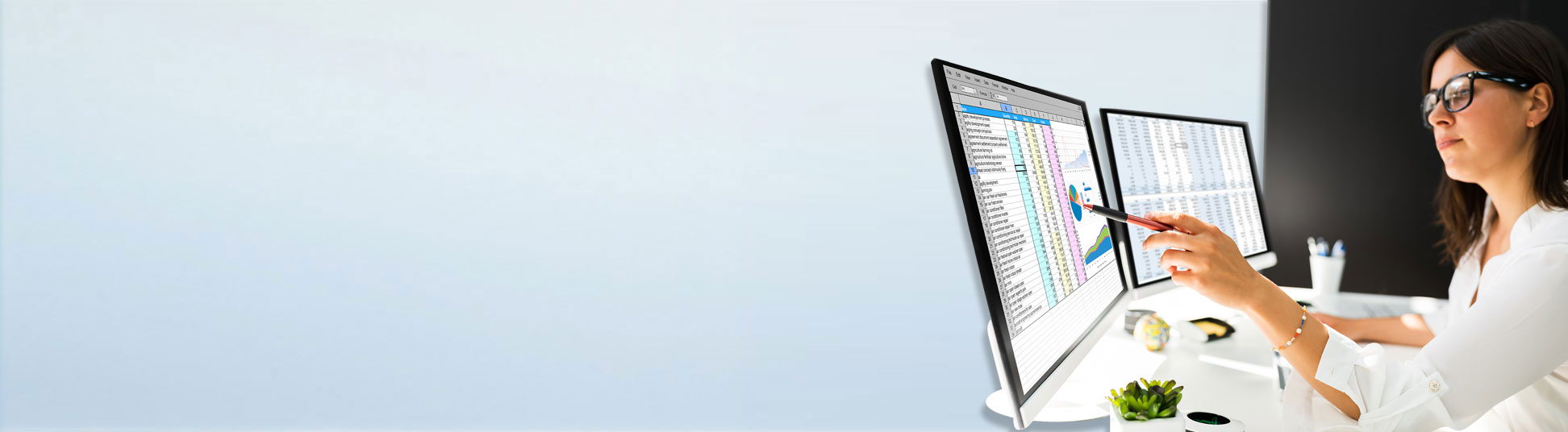 A woman viewing graphic data on a computer screen.