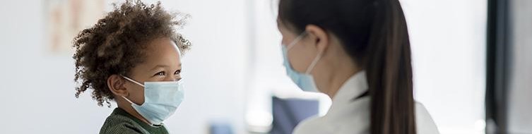 smiling child with doctore